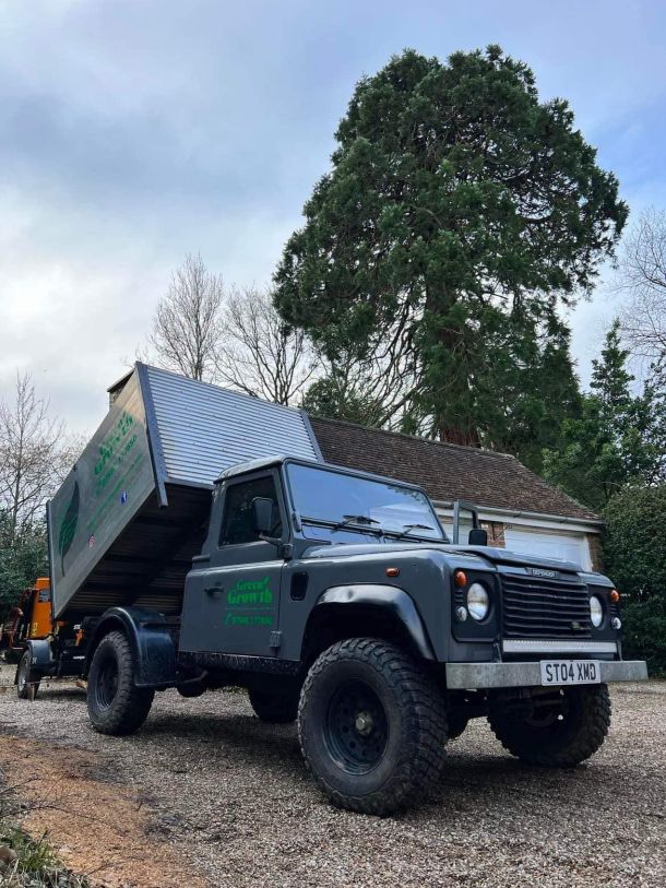 Green Growth Tree Services Land Rover tipper truck.